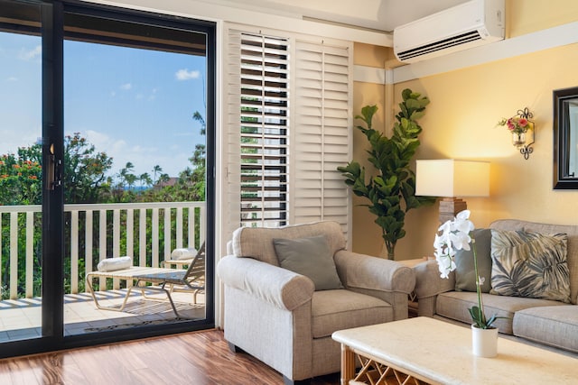 2253 Poipu Rd Unit 326, Koloa, HI 96756 - living area with a wall mounted AC, plenty of natural light, and wood finished floors