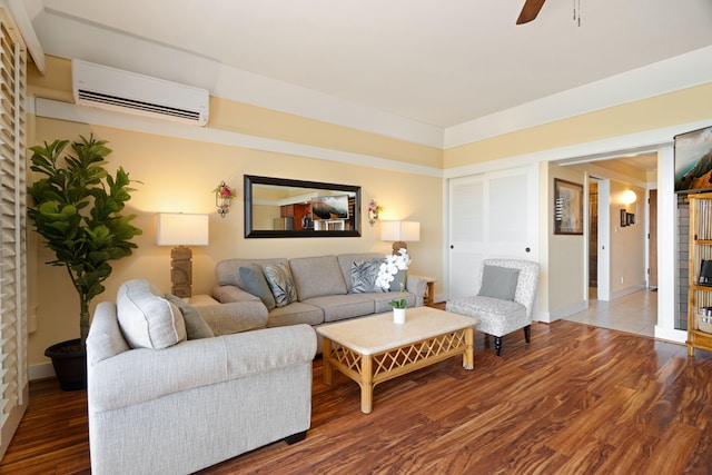 2253 Poipu Rd Unit 326, Koloa, HI 96756 - living area with a wall mounted AC, wood finished floors, a ceiling fan, and baseboards