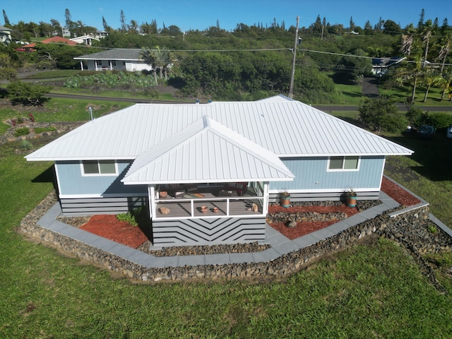 94-1770 Kaulua St, Naalehu, HI 96772 - back of property with metal roof and a lawn