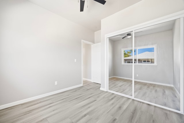 850 Kamalu Rd, Kapaa, HI 96746 - unfurnished bedroom featuring wood finished floors, a ceiling fan, baseboards, and a closet