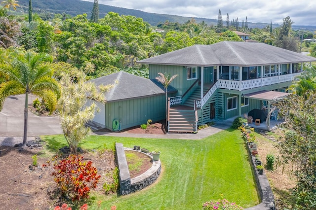 83-1008 Kahula Pl, Captain Cook, HI 96704 - view of front of home with stairs, a front lawn, roof with shingles, and a deck with mountain view