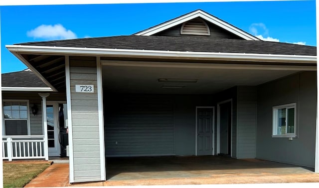 723 Laulea St, Eleele, HI 96705 - doorway to property featuring a shingled roof