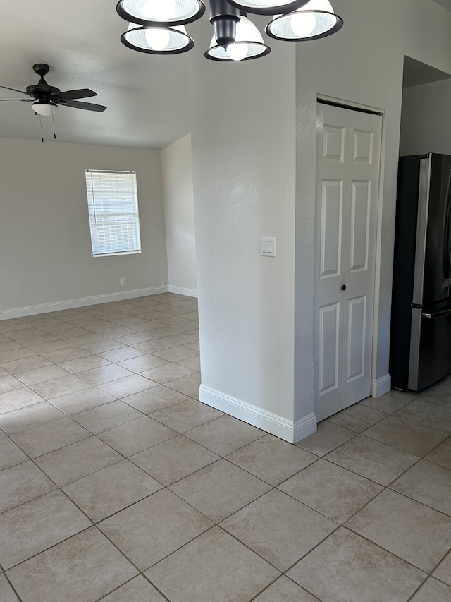 723 Laulea St, Eleele, HI 96705 - spare room with light tile patterned floors, ceiling fan, and baseboards