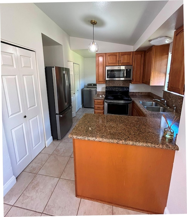 723 Laulea St, Eleele, HI 96705 - kitchen featuring stainless steel appliances, lofted ceiling, a sink, a peninsula, and brown cabinets