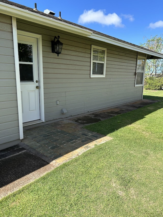 723 Laulea St, Eleele, HI 96705 - view of property exterior with a yard and a patio area