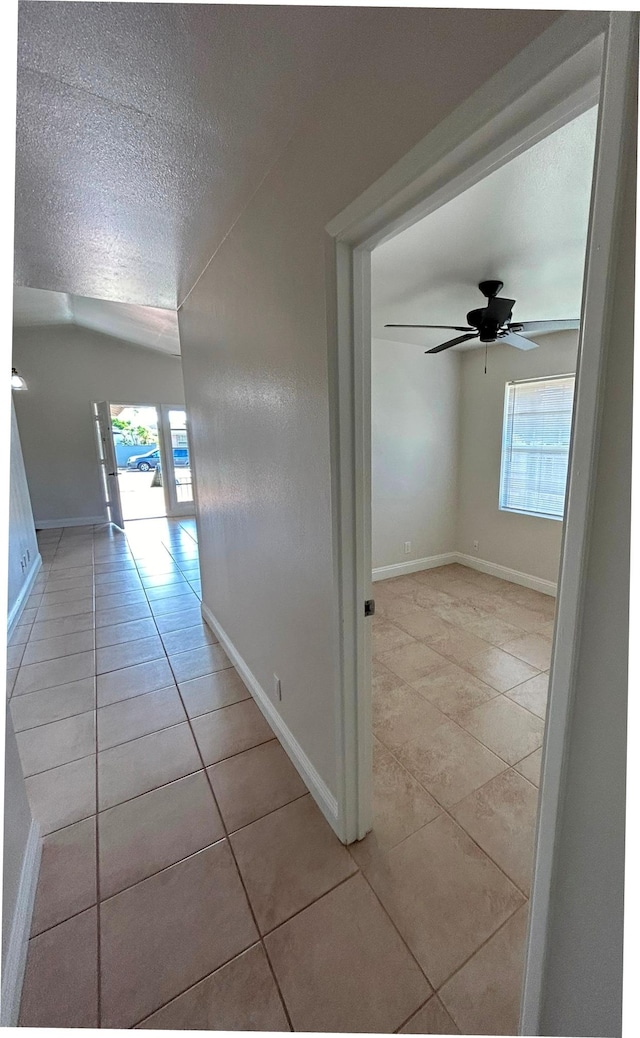 723 Laulea St, Eleele, HI 96705 - hall featuring light tile patterned floors, a textured ceiling, and baseboards