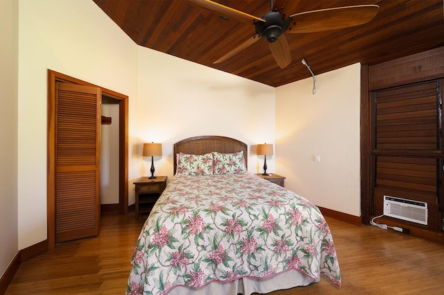 36-2850 Hawaii Belt Rd, Ookala, HI 96774 - bedroom with a wall unit AC, baseboards, wooden ceiling, wood finished floors, and lofted ceiling