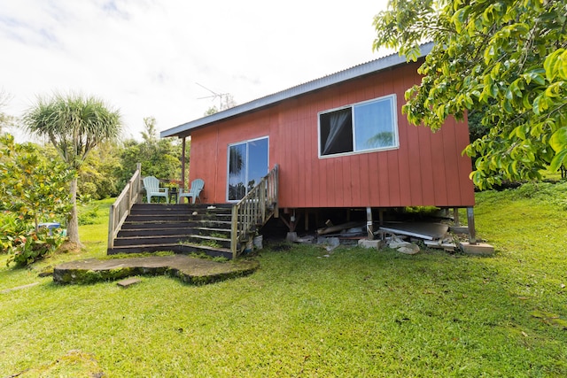 87-2642 Hawaii Belt Rd, Captain Cook, HI 96704 - back of property featuring a yard, a wooden deck, and metal roof