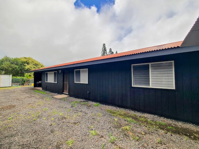 94-6451 Kamaoa Rd, Naalehu, HI 96772 - view of home's exterior with metal roof