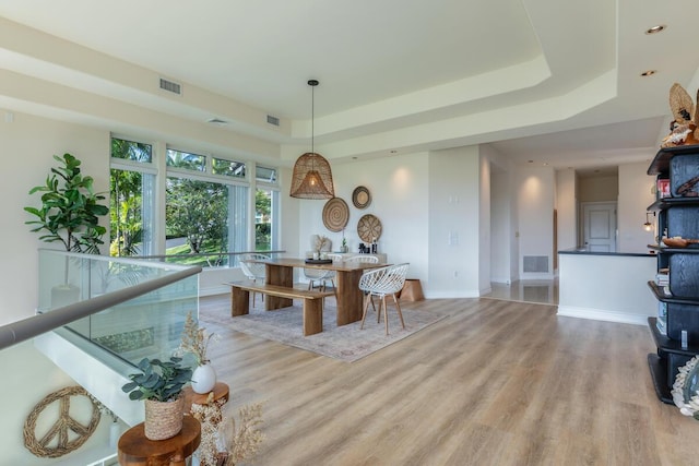 4100 Queen Emmas Dr Unit 7, Princeville, HI 96722 - dining area featuring a raised ceiling, wood finished floors, baseboards, and recessed lighting