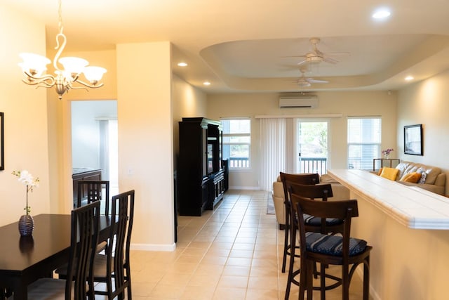 15-1688 9th Ave, Keaau, HI 96749 - dining room featuring a wall unit AC, a chandelier, baseboards, recessed lighting, and light tile patterned flooring