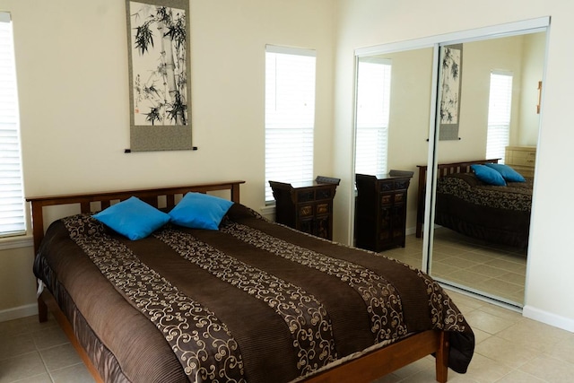 15-1688 9th Ave, Keaau, HI 96749 - bedroom featuring light tile patterned floors, baseboards, and a closet