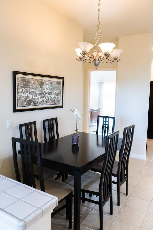 15-1688 9th Ave, Keaau, HI 96749 - dining room featuring a chandelier, light tile patterned floors, and baseboards