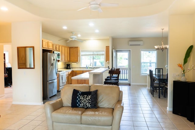 15-1688 9th Ave, Keaau, HI 96749 - living room featuring a wall mounted air conditioner, a ceiling fan, light tile patterned floors, baseboards, and recessed lighting