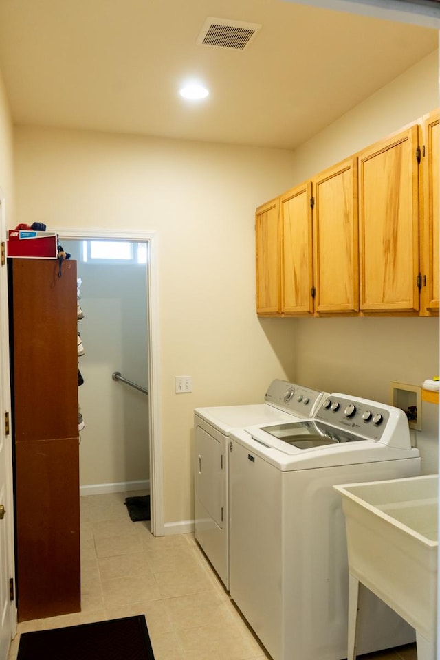 15-1688 9th Ave, Keaau, HI 96749 - laundry area with independent washer and dryer, cabinet space, light tile patterned floors, baseboards, and recessed lighting
