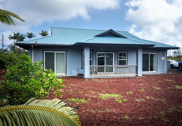 15-1688 9th Ave, Keaau, HI 96749 - rear view of house featuring a porch and metal roof
