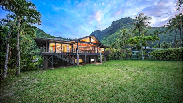 5-7834 Kuhio Hwy, Hanalei, HI 96714 - view of green lawn with stairs and a deck with mountain view