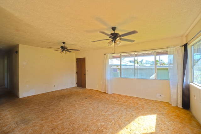 14-3435 Nanawale Blvd, Pahoa, HI 96778 - spare room with a textured ceiling, carpet flooring, and ceiling fan