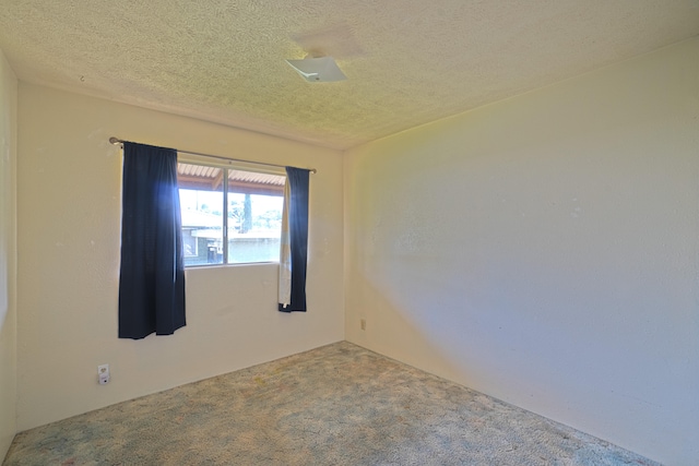 14-3435 Nanawale Blvd, Pahoa, HI 96778 - carpeted spare room featuring a textured ceiling