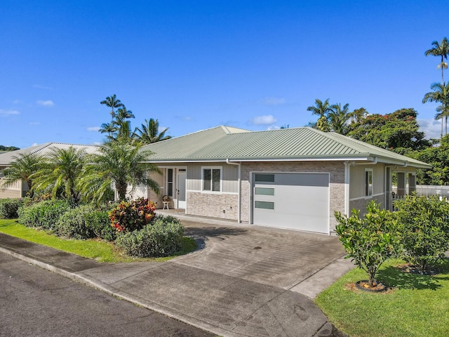 99 Kamalii St, Hilo, HI 96720 - single story home featuring an attached garage, concrete driveway, and metal roof