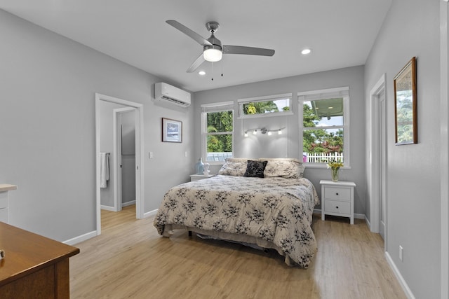 99 Kamalii St, Hilo, HI 96720 - bedroom featuring light wood-style flooring, an AC wall unit, baseboards, recessed lighting, and a ceiling fan