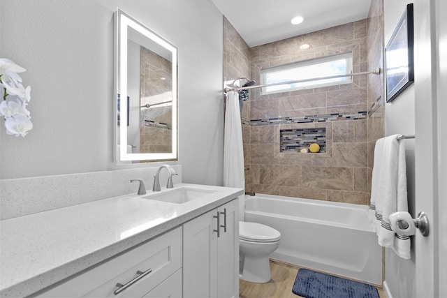 99 Kamalii St, Hilo, HI 96720 - bathroom featuring vanity, toilet, shower / tub combo with curtain, and wood finished floors