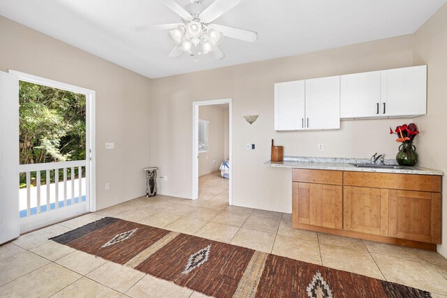 77-6451 Marlin Rd, Kailua-Kona, HI 96740 - kitchen featuring a sink, light tile patterned flooring, ceiling fan, and white cabinets