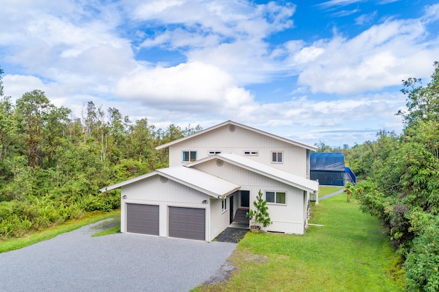 11-3064 Lehua St, Mountain View, HI 96771 - view of front of property featuring a front yard, driveway, and a garage