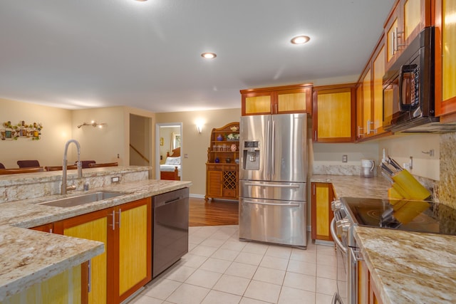 11-3064 Lehua St, Mountain View, HI 96771 - kitchen featuring stainless steel appliances, a sink, light tile patterned flooring, brown cabinets, and recessed lighting
