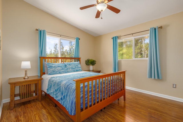 11-3064 Lehua St, Mountain View, HI 96771 - bedroom featuring wood finished floors, multiple windows, vaulted ceiling, baseboards, and a ceiling fan