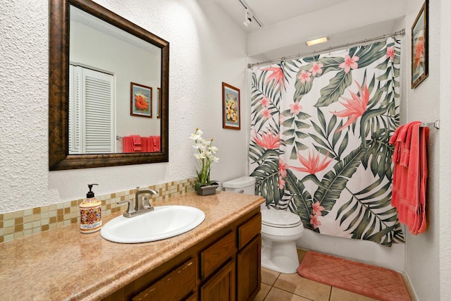 4480 Ka Haku Rd Unit 204, Princeville, HI 96722 - full bathroom with toilet, vanity, tile patterned flooring, backsplash, and a shower with shower curtain