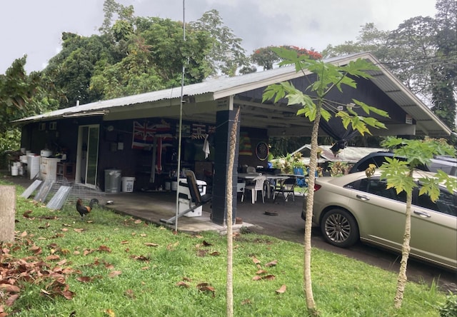 14-3405 Leisure Ln, Pahoa, HI 96778 - view of home's exterior featuring a carport and a yard