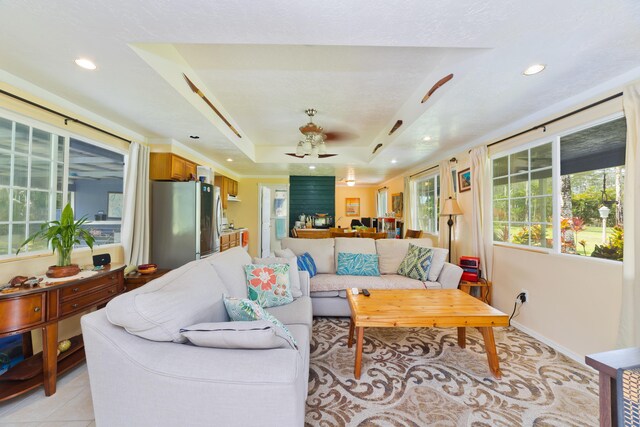 15-2059 10th Ave, Keaau, HI 96749 - living area featuring recessed lighting, a tray ceiling, a ceiling fan, and baseboards