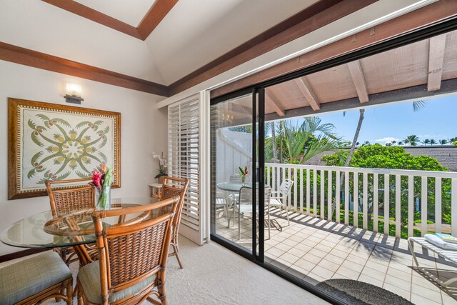 2253 Poipu Rd Unit 109, Koloa, HI 96756 - dining area featuring vaulted ceiling and carpet flooring