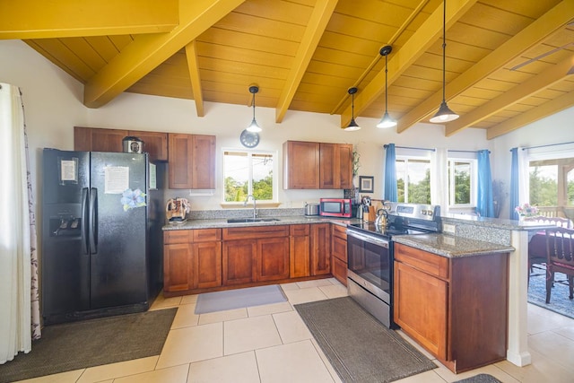 12-7059 Puulena St, Pahoa, HI 96778 - kitchen featuring appliances with stainless steel finishes, a sink, a peninsula, decorative light fixtures, and light tile patterned floors