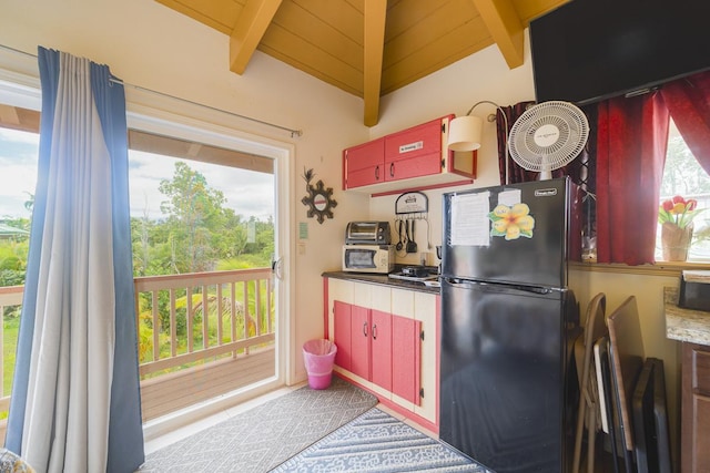12-7059 Puulena St, Pahoa, HI 96778 - kitchen with freestanding refrigerator, beamed ceiling, and red cabinets