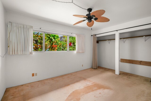 4833 Ou Pl, Princeville, HI 96722 - unfurnished bedroom with multiple closets, carpet, and a ceiling fan