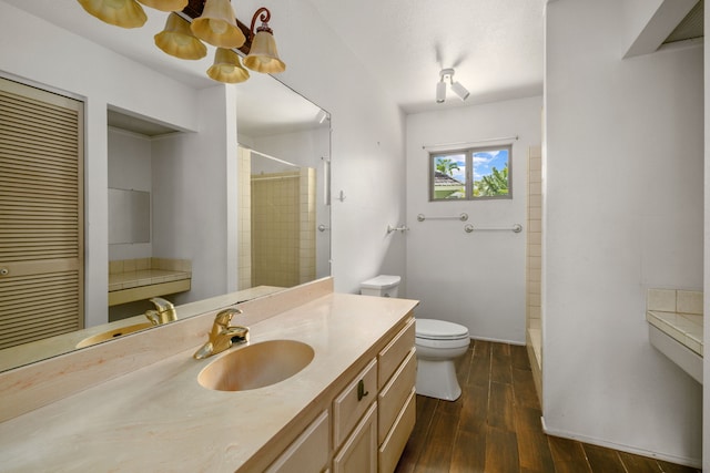 4833 Ou Pl, Princeville, HI 96722 - bathroom with toilet, vanity, wood finished floors, and a shower