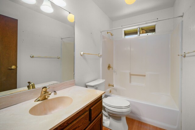 4833 Ou Pl, Princeville, HI 96722 - bathroom with vanity, toilet, bathing tub / shower combination, and wood finished floors