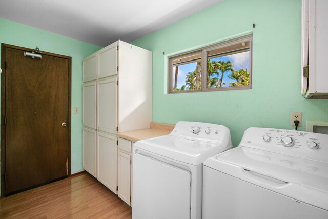 4833 Ou Pl, Princeville, HI 96722 - laundry area with cabinet space, washing machine and dryer, and light wood finished floors