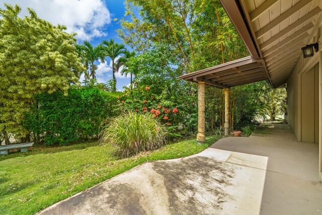 4833 Ou Pl, Princeville, HI 96722 - view of green lawn featuring a patio area