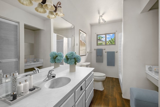 4833 Ou Pl, Princeville, HI 96722 - full bath with toilet, a shower with curtain, vanity, wood finished floors, and baseboards