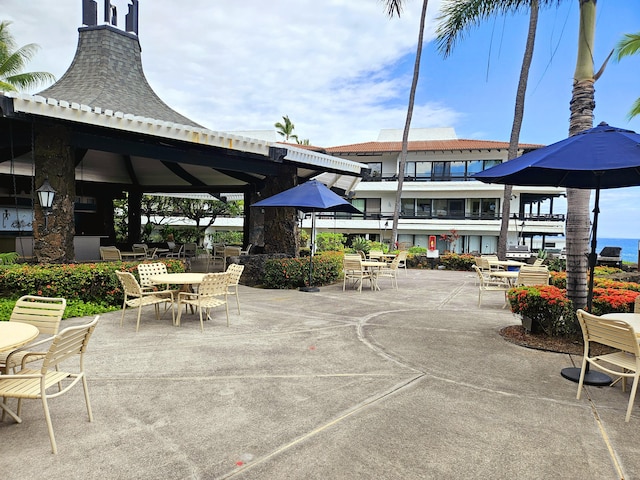 75-6082 Alii Dr Unit A201, Kailua-Kona, HI 96740 - view of property's community with a gazebo, outdoor dining area, and a patio area