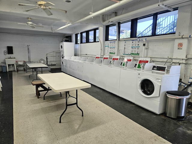 75-6082 Alii Dr Unit A201, Kailua-Kona, HI 96740 - communal laundry room with washer and clothes dryer, tile patterned floors, healthy amount of natural light, and concrete block wall