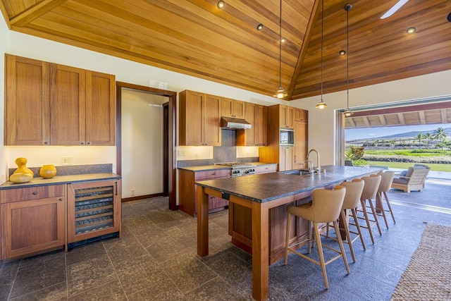73-4839 Maia Loop Unit 40, Kailua-Kona, HI 96740 - kitchen with a sink, granite floors, beverage cooler, under cabinet range hood, and wooden ceiling