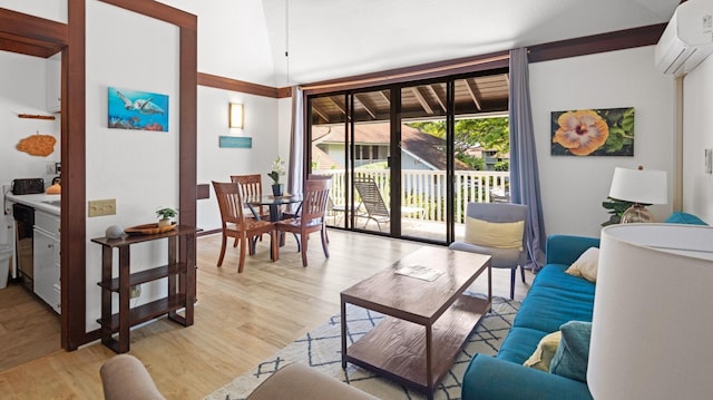 2253 Poipu Rd Unit 170, Koloa, HI 96756 - living room featuring light wood-type flooring and a wall unit AC