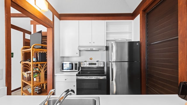 2253 Poipu Rd Unit 170, Koloa, HI 96756 - kitchen featuring appliances with stainless steel finishes, ventilation hood, open shelves, white cabinetry, and light countertops
