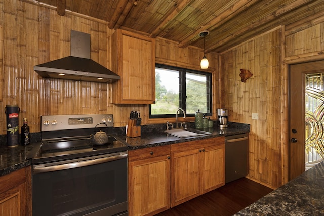 28-3033 Beach Rd, Pepeekeo, HI 96783 - kitchen with appliances with stainless steel finishes, wall chimney exhaust hood, a sink, wood walls, and dark wood finished floors