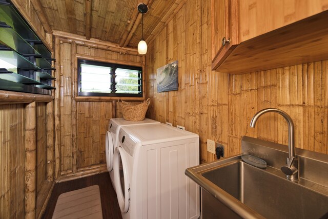 28-3033 Beach Rd, Pepeekeo, HI 96783 - washroom with cabinet space, wooden walls, washer and clothes dryer, and wooden ceiling