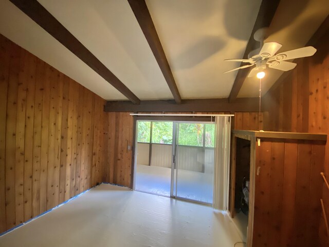 15-2773 Ono St, Pahoa, HI 96778 - unfurnished bedroom featuring wooden walls, beamed ceiling, and access to exterior